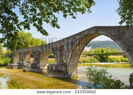 The Famous Stone Bridge Of Arta, In Epirus Region, In Greece. It Is The Most Legendary Stone Bridge 