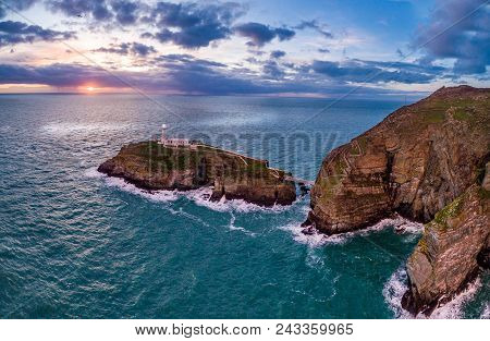 Aerial View Of South Stack With Lighthouse During Sunset.