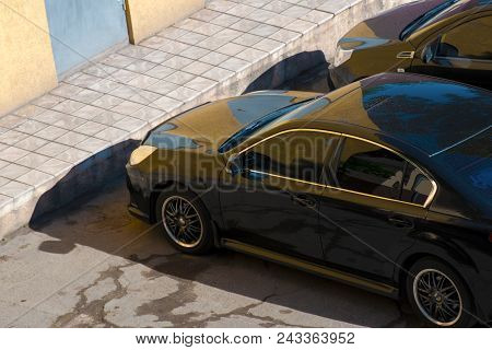 Black Car, View From Above. The Car Is Parked.