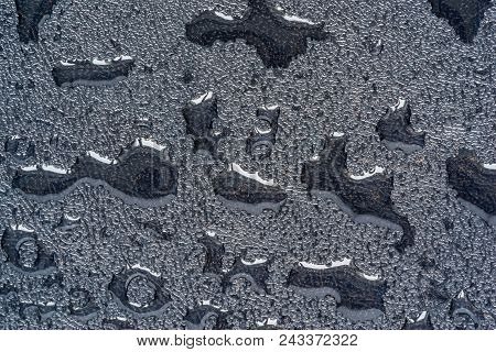 Closeup Of The Wet Textured Rough Surface Of Selenic Color With Drops Of Water Of An Abstract Form F