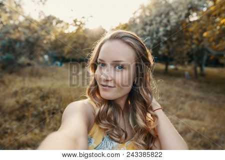 Stylish Modern Girl Taking A Selfie Out In The Park.