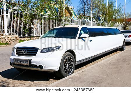 Moscow, Russia - March 3, 2018: White Limousine Infiniti Fx45 In The City Street.