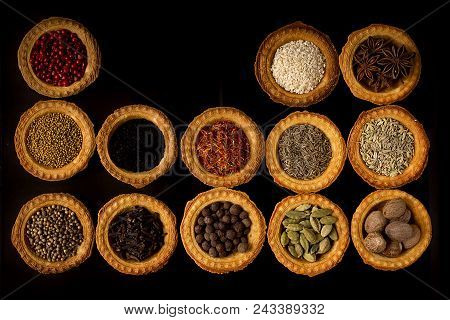 Tartlets With Spices On A Black Background