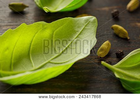 Basil Leaves On Old Wooden Background. Fresh