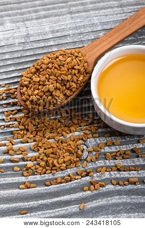 Fragrant Grains Of Fenugreek On A Rustic Background.