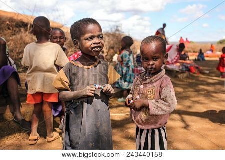 Unknown Masai Village Near Amboselli Park, Kenya - April 02, 2015: Poor Dirty Masai Children With Fa