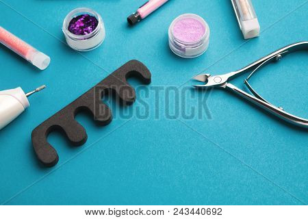 Manicure And Pedicure Beauty Accessories On Blue Background, Copy Space. Nail Polish Samples, Scisso