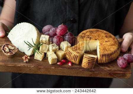 Cheese Platter In Hands Of Cheese Maker