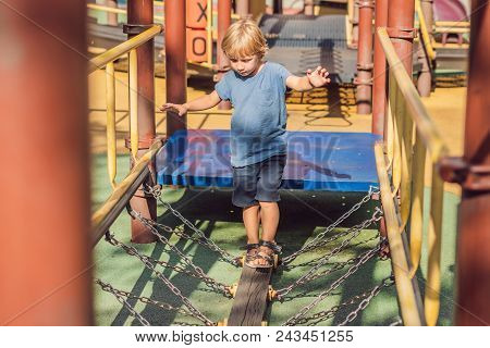 Funny Cute Happy Baby Playing On The Playground. The Emotion Of Happiness, Fun, Joy.