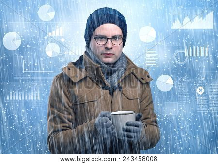 Young businessman shivering with graphs, reports and chart concept