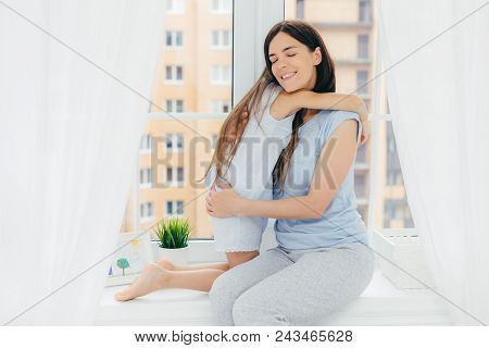People, Relationship And Parenthood Concept. Positive Affectionate Female With Pleasant Appearance, 