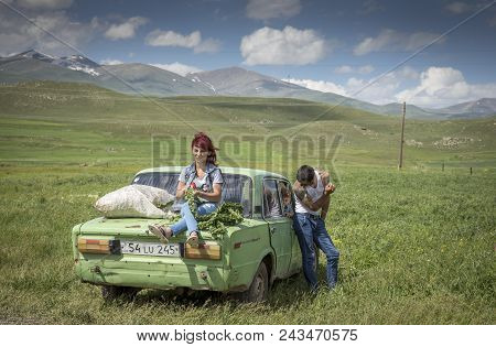 Areni, Armenia, 1st June, 2018: Family With Their Car On The Raodside, Collecting Herbs For Winter