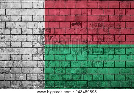 Madagascar Flag Is Painted Onto An Old Brick Wall