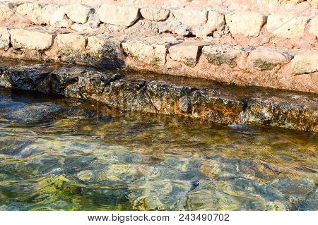 Old Ancient Yellow Stone Steps Covered With Brown Friable Sand With Waves And Irregularities, Descen