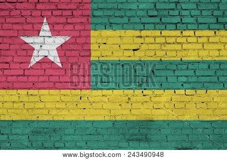 Togo Flag Is Painted Onto An Old Brick Wall