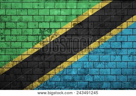 Tanzania Flag Is Painted Onto An Old Brick Wall
