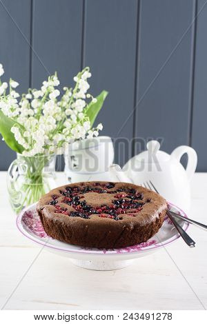 Homemade Chocolate Berry Cake With Bird Cherry Flour. Tasty Bird Cherry Cake Served With White Teawa