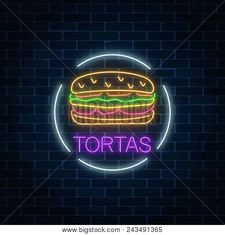 Neon Glowing Sign Of Tortas In Circle Frame On A Dark Brick Wall Background. Fastfood Light Billboar