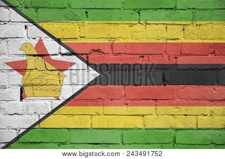 Zimbabwe Flag Is Painted Onto An Old Brick Wall