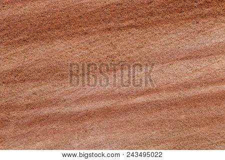 Brown Sandstone Wall Texture Details. Close-up Photo Of Gritty Background. Horizontal Orientation