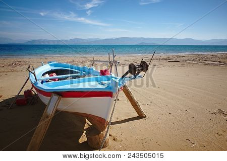 Fisherboat Before Tourist Season At Kavos Beach In Corfu, Greece