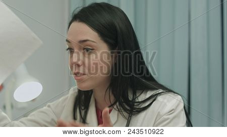 Upset Female Doctor Loudly Speaks, Smiles And Laughs In Hysterical