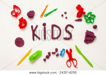 The Text Kids Made From Colorful Modelling Clay And Some Toys Such As Sand Moulds And Tools For Mold