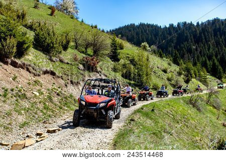 A Tour Group Travels On Atvs And Utvs On The Mountains.