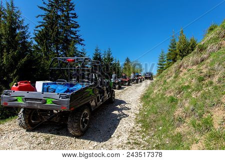 A Tour Group Travels On Atvs And Utvs On The Mountains.