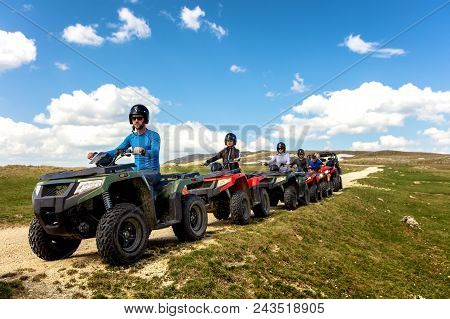 Friends Driving Off-road With Quad Bike Or Atv And Utv Vehicles.