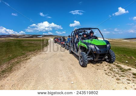 Friends Driving Off-road With Quad Bike Or Atv And Utv Vehicles.