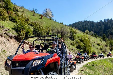 A Tour Group Travels On Atvs And Utvs On The Mountains.