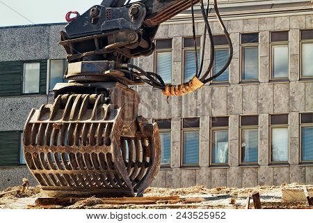 An Excavator Bucket Standing By At A Demolition Site In The Middle Of The Town Of Oulu In The Northe