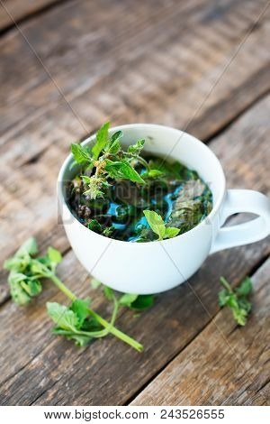 Herbal Green Mint Tea In White Cup On Wooden Background Healthy Bevarage