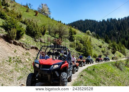 A Tour Group Travels On Atvs And Utvs On The Mountains.