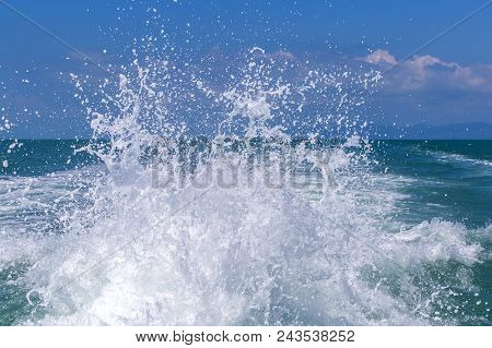 Blue Ocean Sea Water Wave With Fast Yacht Boat Wake Foam Of Prop Wash, Thailand. Close Up
