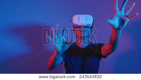 Man playing with virtual reality device 