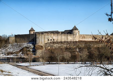 Narva, Estonia - March 30, 2018: View Of The Ivangorod And Narva Fortress From Narva City