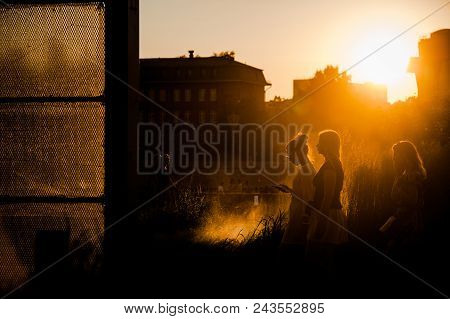 Moscow, Russia - June 25, 2016: Girls Walking At Sunset In The Museon Art Park.