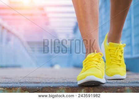 Close-up Of Man's Running Shoes While Walking Towards The Camera.