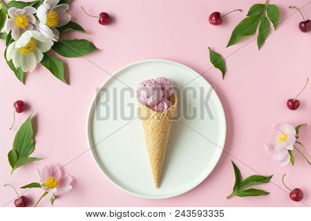 Flatlay Of Pink Ice Cream Scoops, Cerry, Sweet Cones And Peonies Over Pastel Pink Background. Top Vi