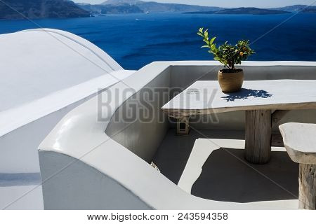 Typical Mediterranean Urban City And Sea Landscape Seen From A Terrace. Santorini Greece