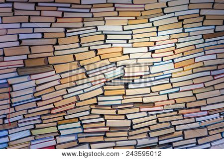 The Wall Made Of Books. The Wall Contains Different Colored Books.