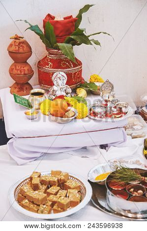 The Ganesha Statue (hindu God Of Wisdom) With Red Velvet Of Kalash On The Back And Worship Items For