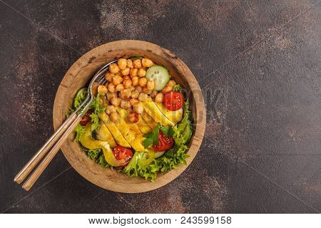 Grilled Chicken Salad With Vegetables And Chickpeas In A Wooden Bowl On A Dark Background, Copy Spac