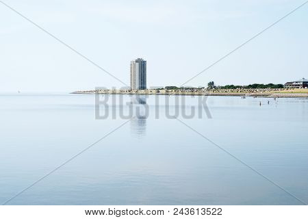 Tourist Town Buesum On The North Sea Coast In Germany, Panoramic View With Beach And Skyscraper