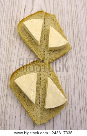 Table Of Cut With Wedge Of Cheese Cut Partially Sliced