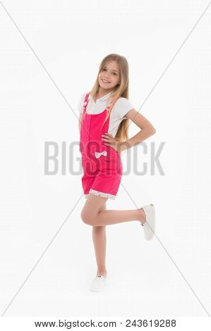 Kid Model In Fashionable Overall. Small Girl Smile In Pink Jumpsuit Isolated On White. Child Smiling