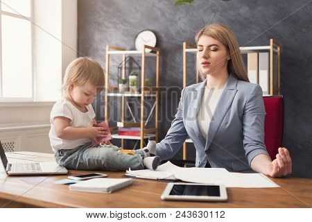 Business Mom Meditating During Working In Office While Her Cute Baby Playing With Toys. Business, Mo