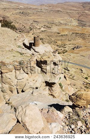 Landscape Of Mountain Yemen In Eastern Haraz. Ancient Watch Tower On Edge The Rock. View From Thula 
